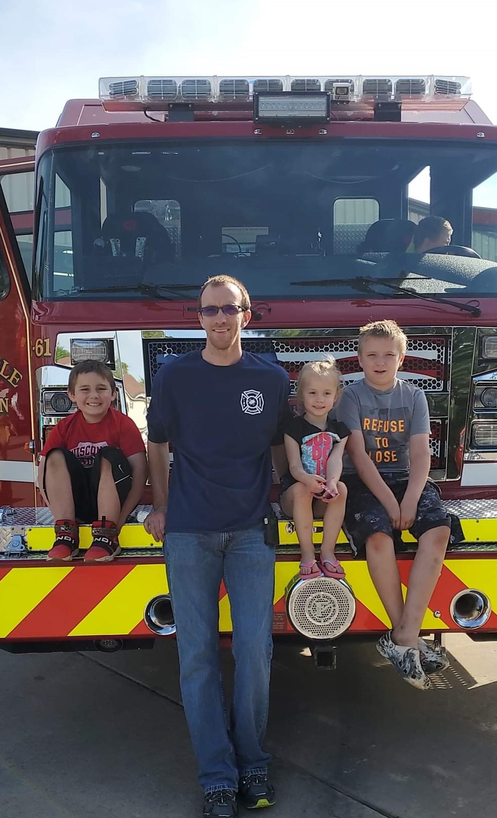 Joe with his Niece and Nephews during a visit to the fire station during their annual pancake breakfast